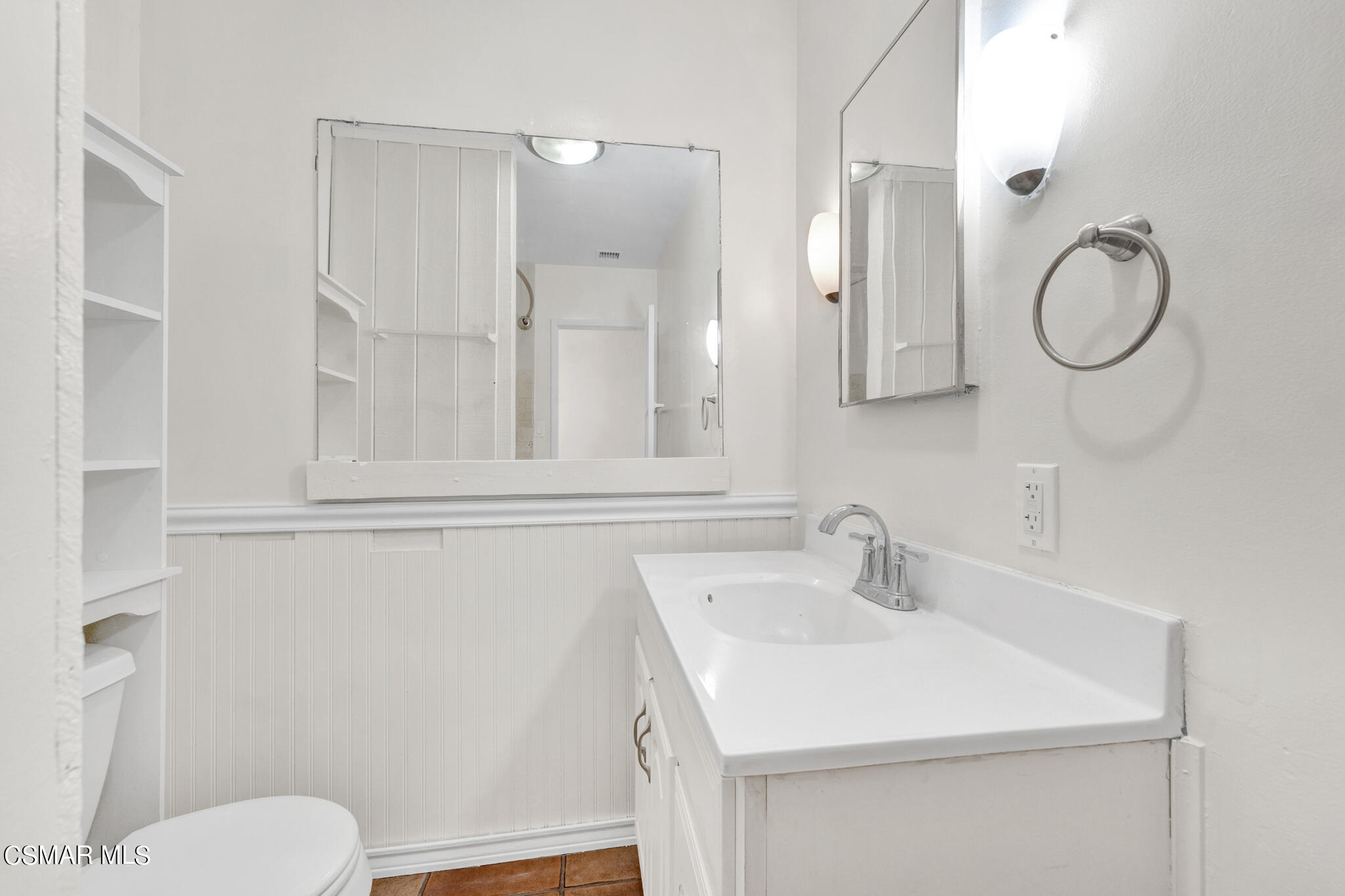 7348 Yolanda Avenue Reseda, CA 91335 - Photo 16 of 23 a bathroom with a sink mirror vanity and toilet