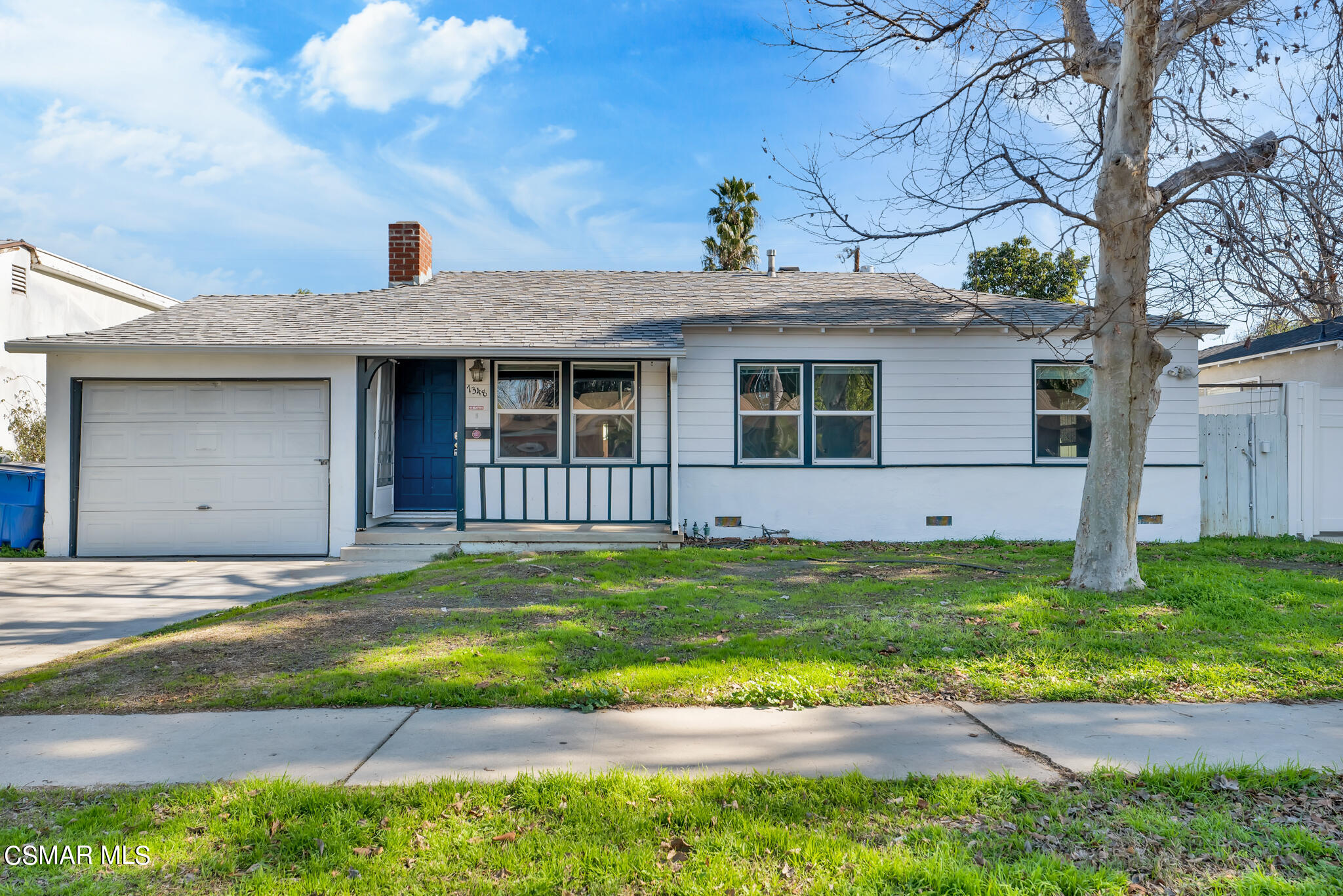 7348 Yolanda Avenue Reseda, CA 91335 - Photo 4 of 23 a view of a house with a yard and a large tree