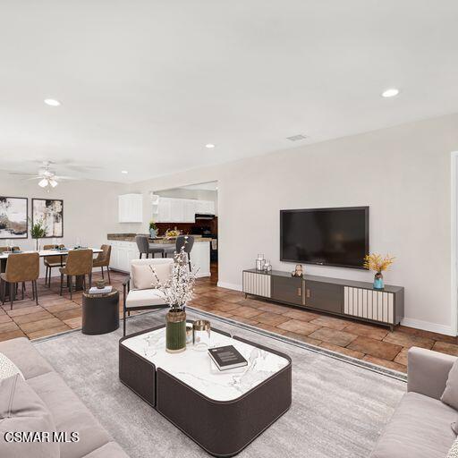 7348 Yolanda Avenue Reseda, CA 91335 - Photo 5 of 23 a living room with furniture and a flat screen tv