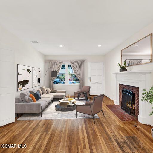 7348 Yolanda Avenue Reseda, CA 91335 - Photo 6 of 23 a living room with furniture and a fireplace