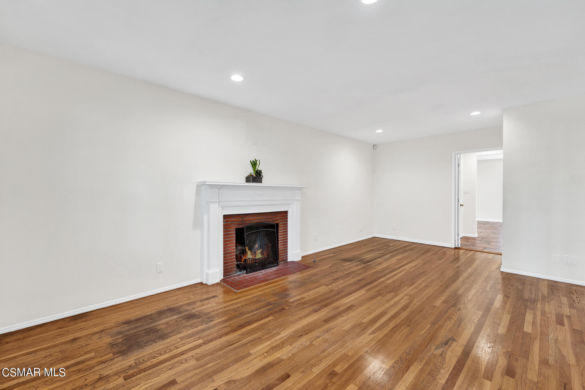 7348 Yolanda Avenue Reseda, CA 91335 - Photo 8 of 23 a view of empty room with wooden floor and fireplace