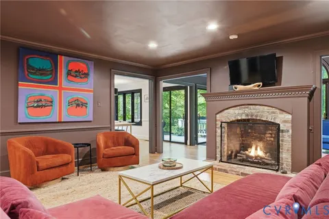 a kitchen with stainless steel appliances granite countertop a stove top oven a sink dishwasher and a refrigerator with wooden floor
