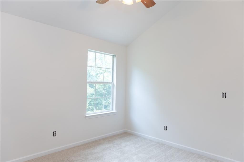 502 Streamside Place Canton, GA 30115 - Photo 25 of 33 an empty room with windows