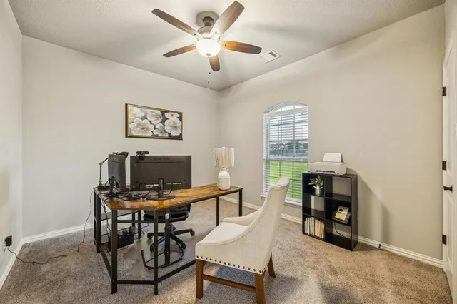 a workspace with furniture and window