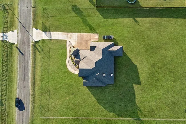a view of a swimming pool with a yard and mountain view