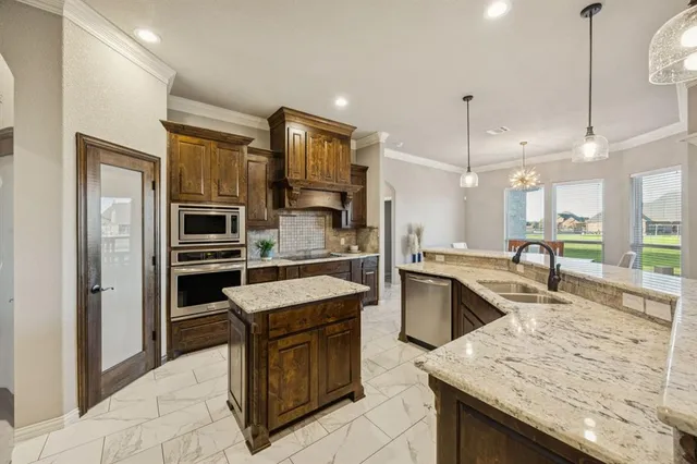 a kitchen with a sink stove and refrigerator