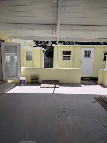 a view of a backyard with large trees