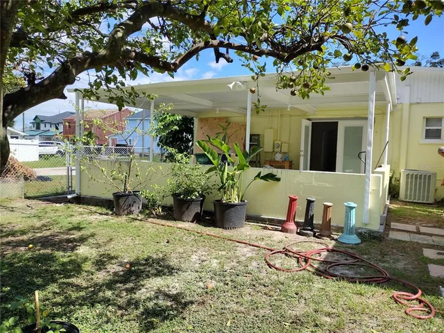 a view of a yard with a tree