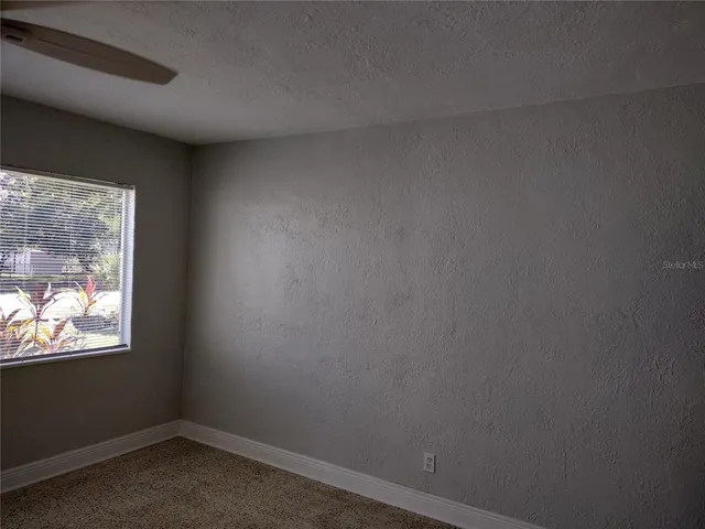 a view of an empty room and window