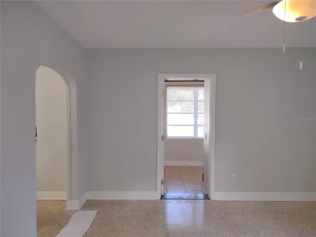 a view of an empty room with a window