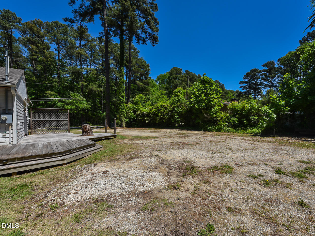 1703 St Patrick Drive Raleigh, NC 27603 - Photo 28 of 29 a backyard of a house with lots of green space