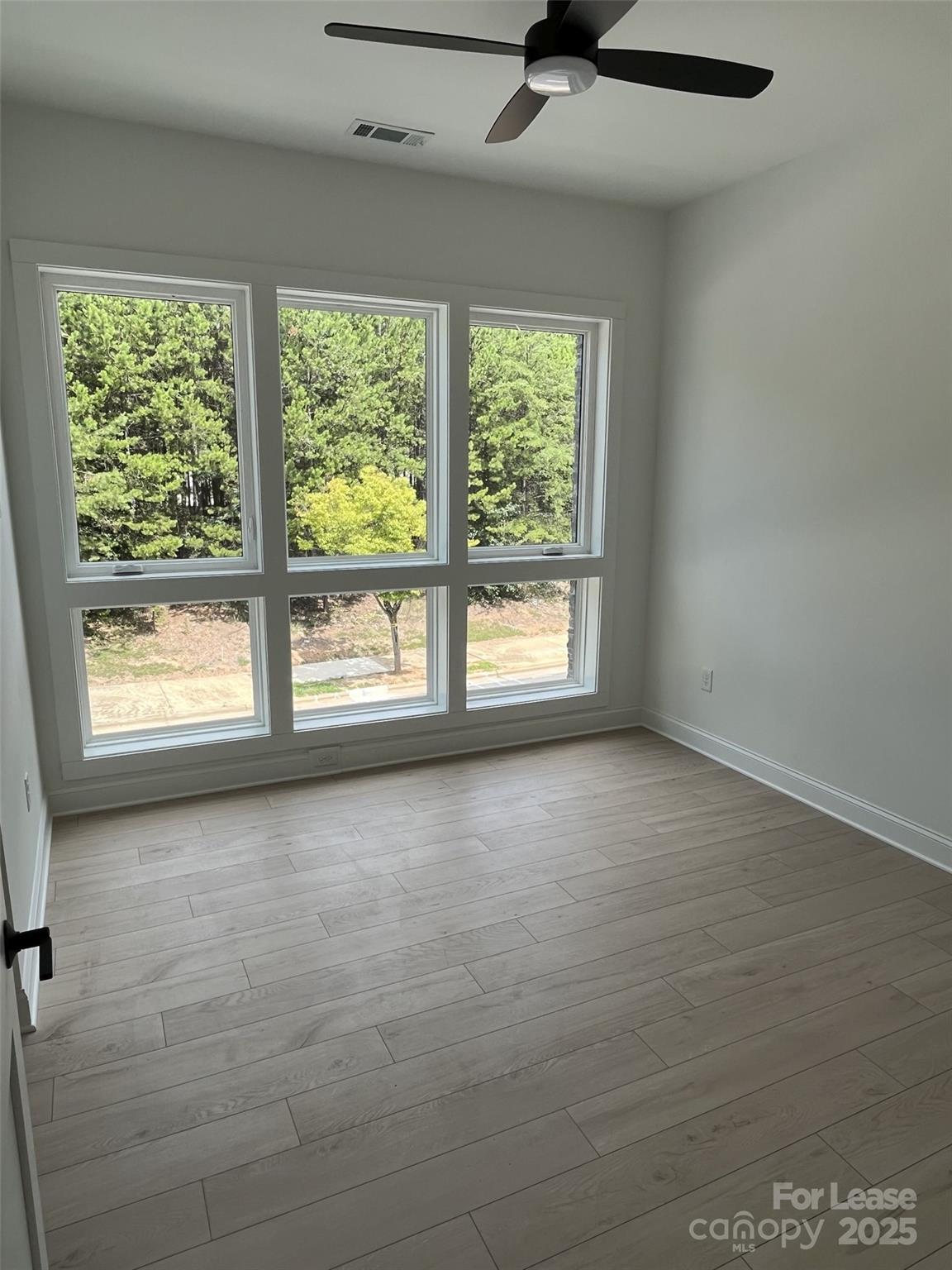19546 Greentree Way, Unit 201 Cornelius, NC 28031 - Photo 23 of 31 a view of an empty room with a window