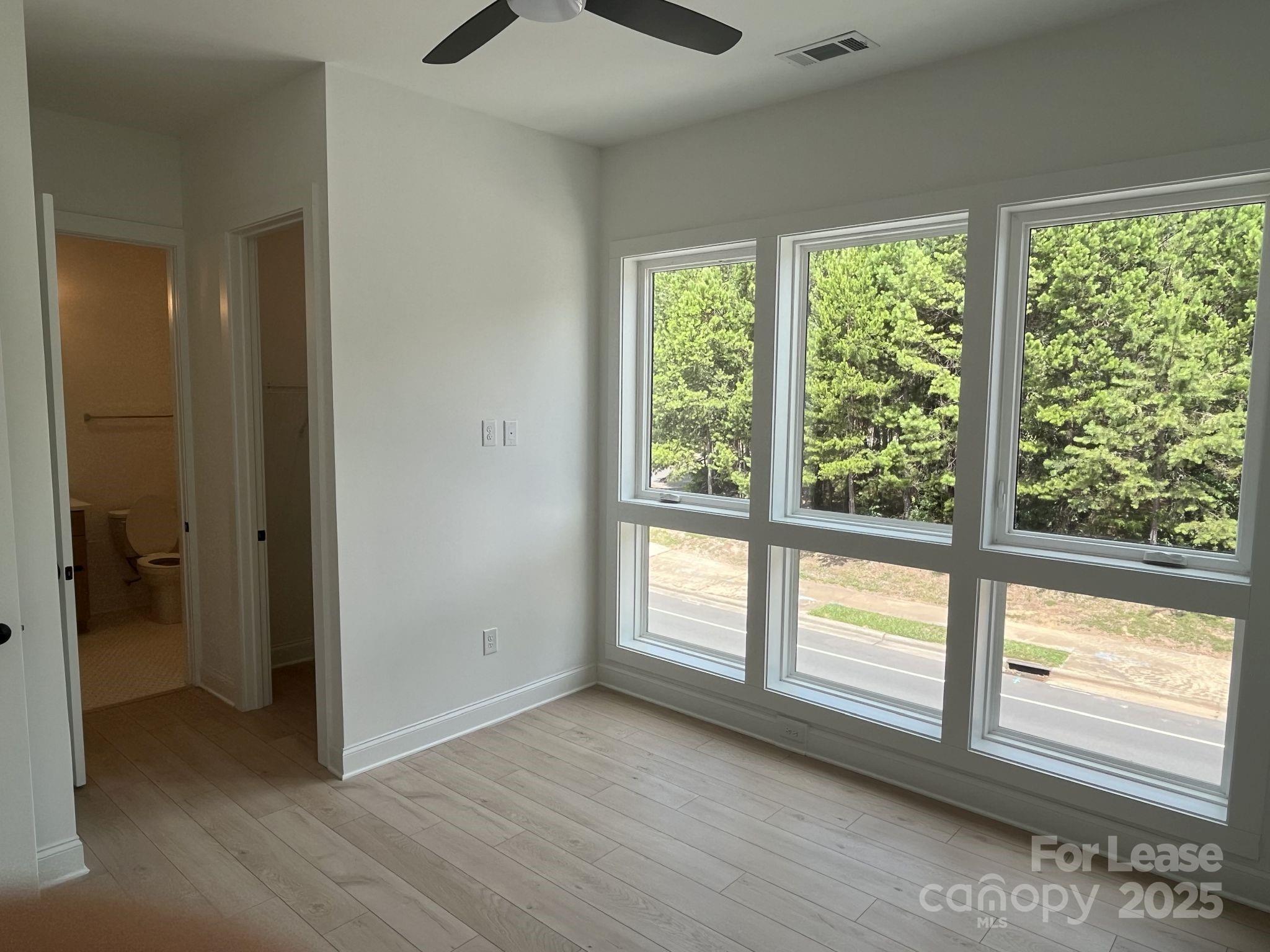 19546 Greentree Way, Unit 201 Cornelius, NC 28031 - Photo 24 of 31 a view of an empty room and window