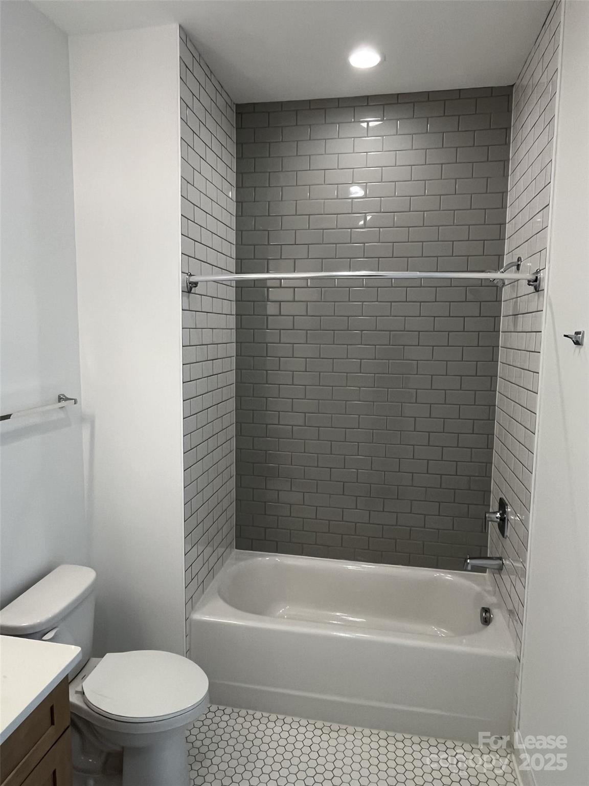 19546 Greentree Way, Unit 201 Cornelius, NC 28031 - Photo 27 of 31 a bathroom with a bathtub and a toilet