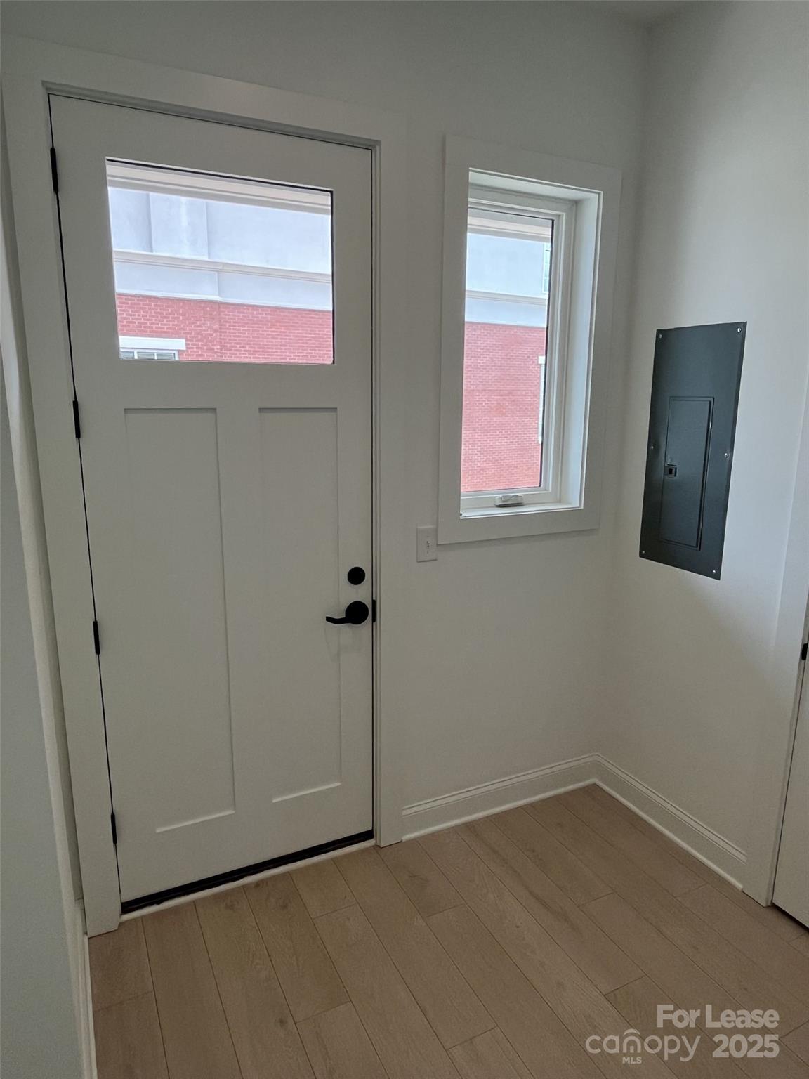 19546 Greentree Way, Unit 201 Cornelius, NC 28031 - Photo 28 of 31 an empty room with windows and closet