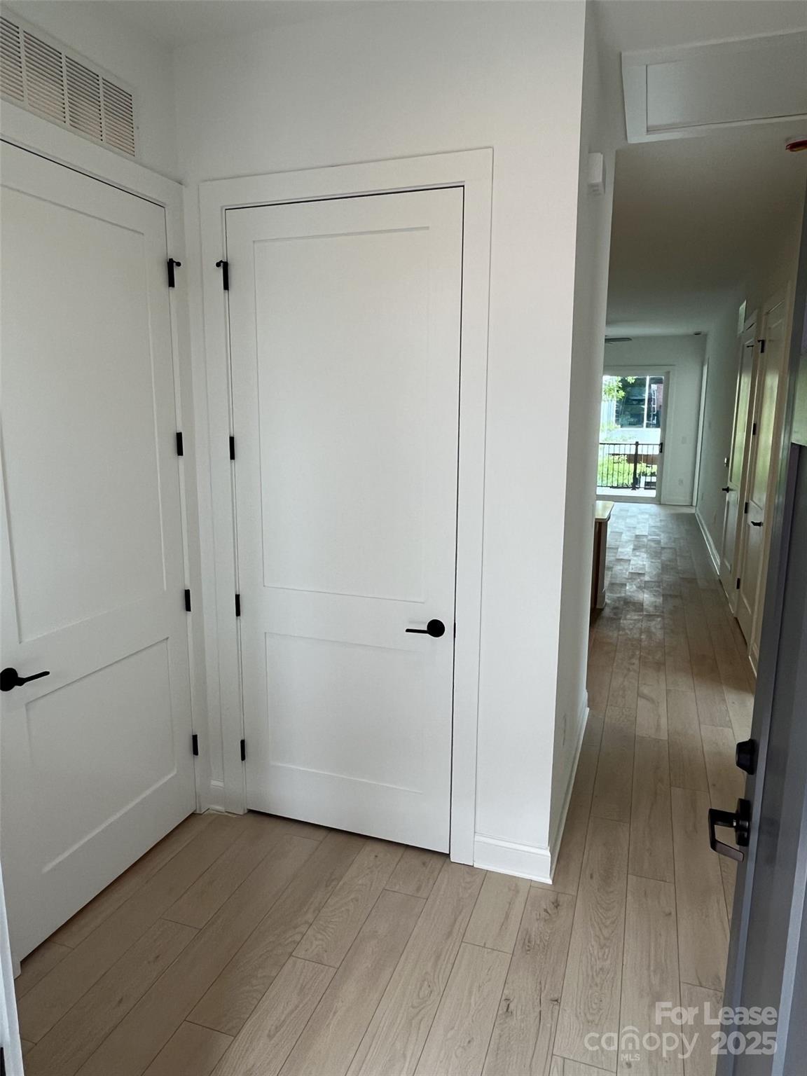 19546 Greentree Way, Unit 201 Cornelius, NC 28031 - Photo 6 of 31 a view of a hallway with wooden floor