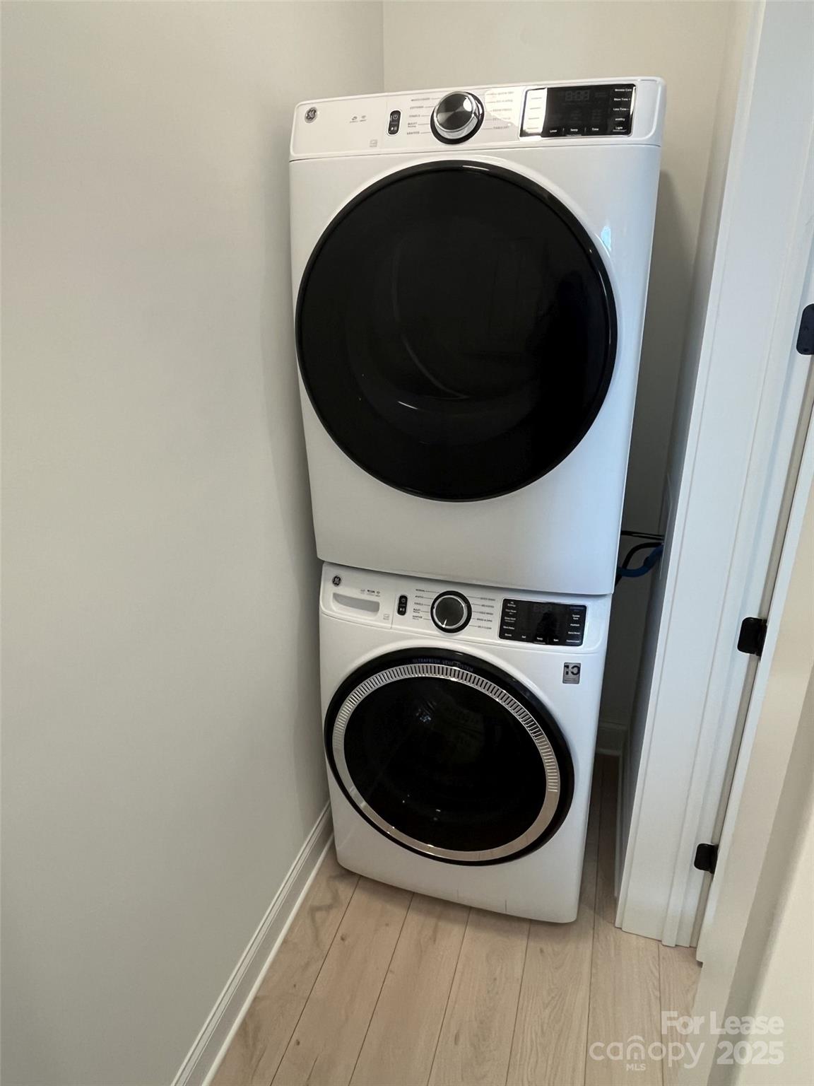 19546 Greentree Way, Unit 201 Cornelius, NC 28031 - Photo 7 of 31 a utility room with dryer and washer