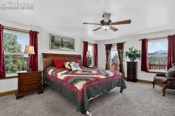 a bedroom with a bed and a couch