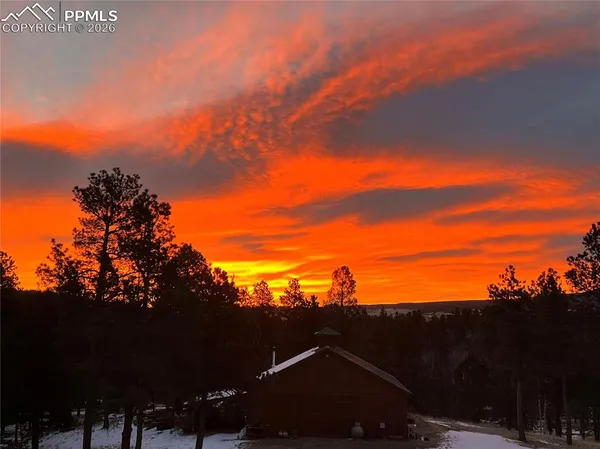 a view of swimming pool from a yard