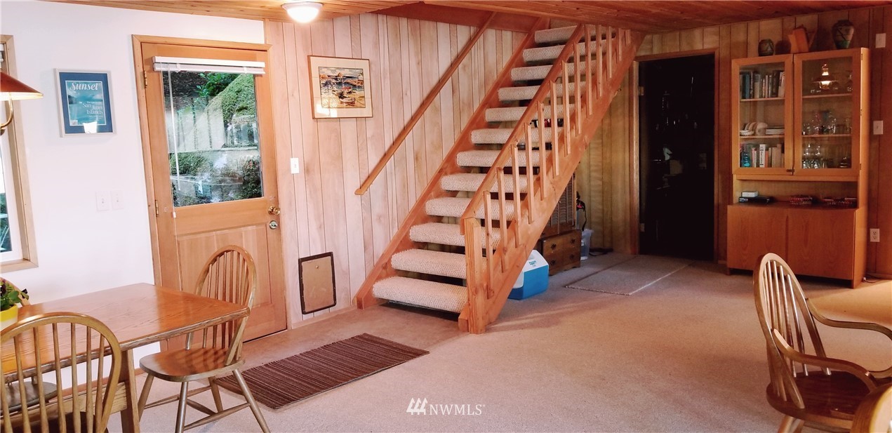 1327 Islandale Road Lopez Island, WA 98261 - Photo 14 of 22 a view of an entryway with wooden floor and windows