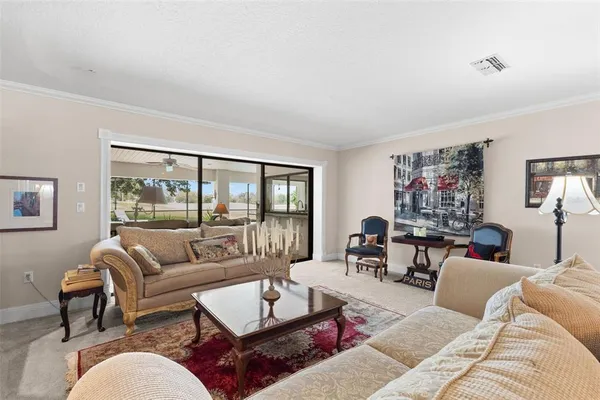 a living room with furniture and a rug