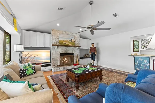 a kitchen with a large window and dining table