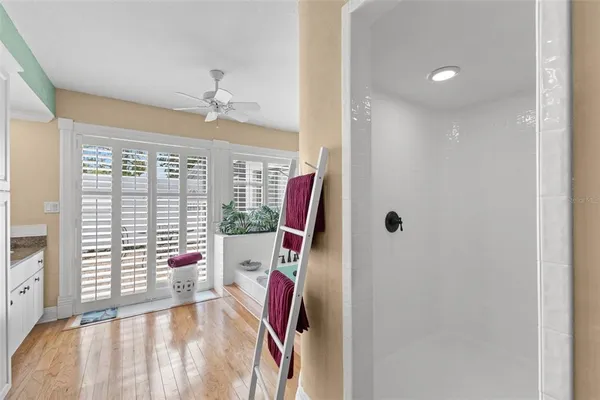 a view of a patio with a dining table and chairs