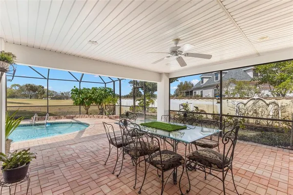a patio area with table and chairs
