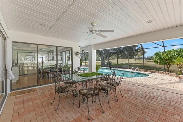 a dining room with furniture and garden view