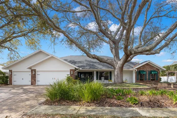 a front view of house with yard and green space