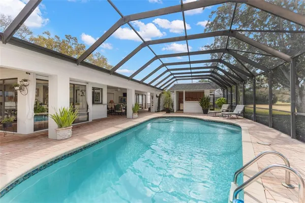 a view of a chairs and fire pit in the patio