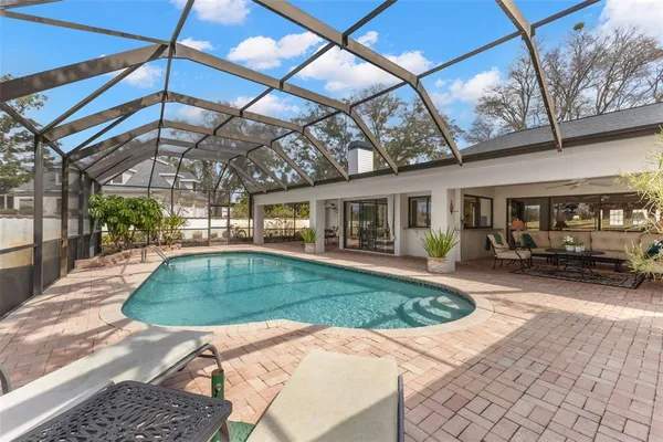 a kitchen with granite countertop white cabinets and stainless steel appliances