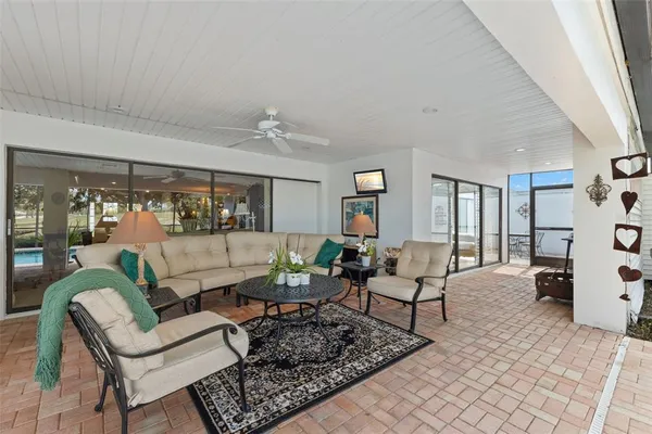 a backyard of a house with table and chairs