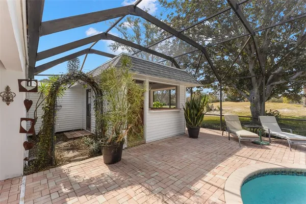 a outdoor space with patio furniture and potted plants