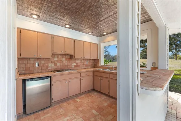 a bedroom with a bed and a lamp