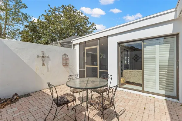 a bathroom with a toilet a sink a tub and mirror