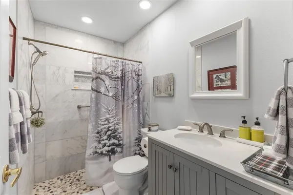 an aerial view of residential houses with outdoor space