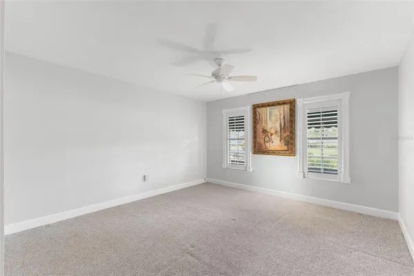 an aerial view of residential houses with city view