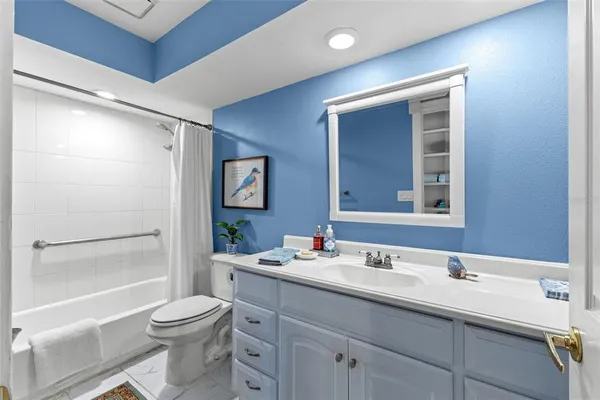 a view of a lake with a mountain and a yard