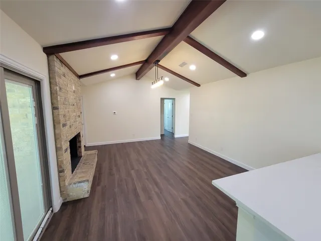 a view of hallway with wooden floor