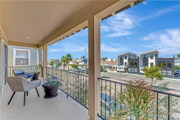 a view of a balcony with chairs