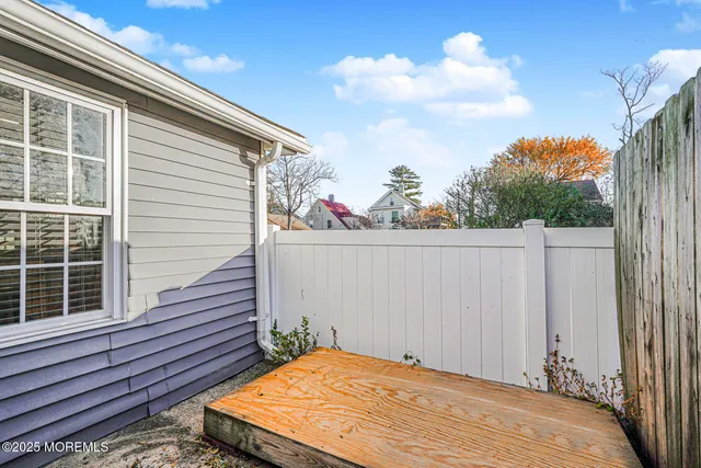 a view of a backyard with furniture
