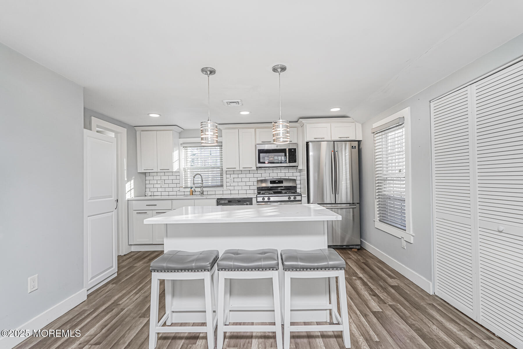 37 Myrtle Avenue Keyport, NJ 07735 - Photo 7 of 16 a view of a kitchen with kitchen island a sink wooden floor and stainless steel appliances