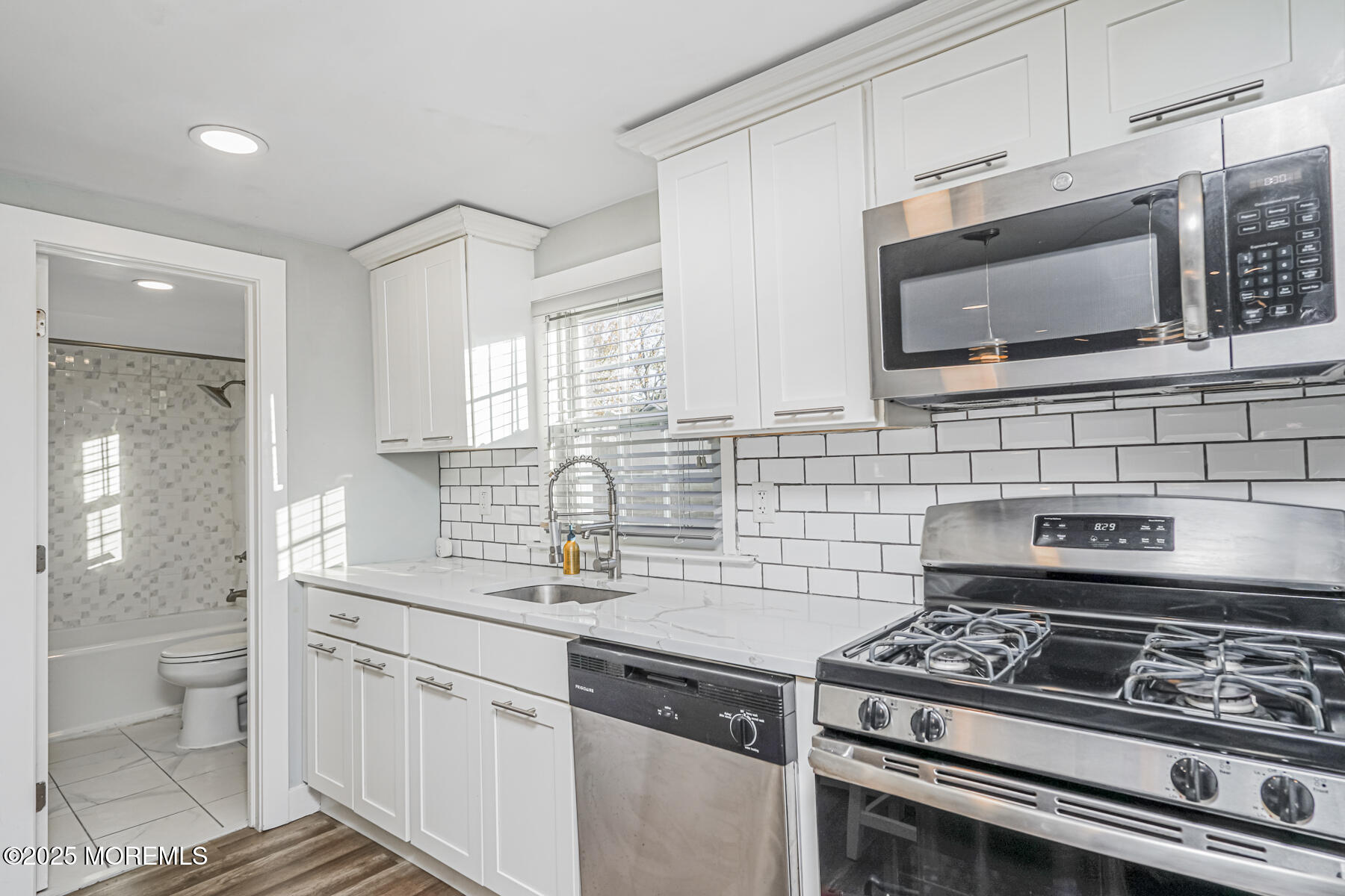 37 Myrtle Avenue Keyport, NJ 07735 - Photo 9 of 16 a kitchen with stainless steel appliances a sink stove and cabinets