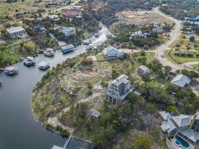 an aerial view of residential houses with outdoor space
