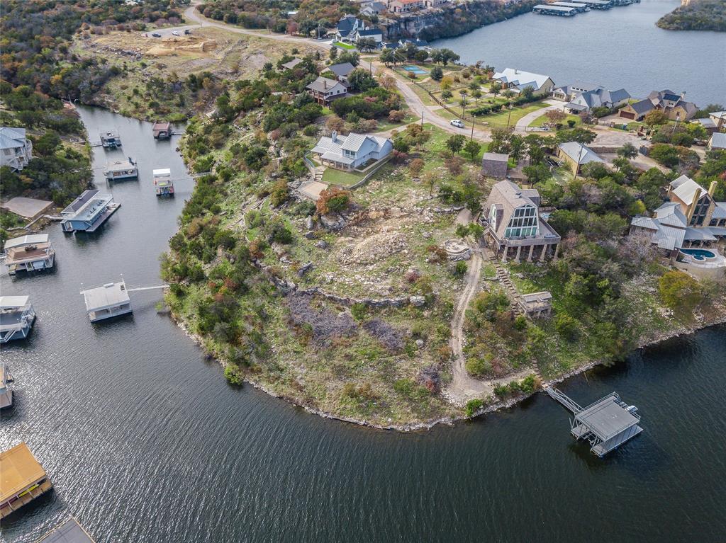 1040 Bluff Creek Point Strawn, TX 76475 - Photo 15 of 30 an aerial view of a house with a yard basket ball court and outdoor seating