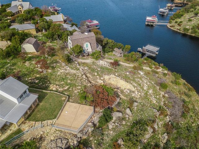 a backyard of a house with lots of green space and garden