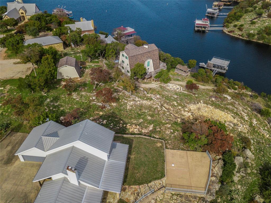 1040 Bluff Creek Point Strawn, TX 76475 - Photo 25 of 30 an aerial view of a house with a yard
