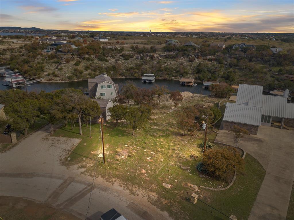 1040 Bluff Creek Point Strawn, TX 76475 - Photo 29 of 30 a view of a lake in middle of the town