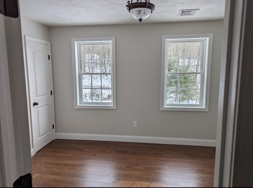 Lot 5-510 Old County Road Wales, MA 01081 - Photo 13 of 32 a view of an empty room with wooden floor and a window